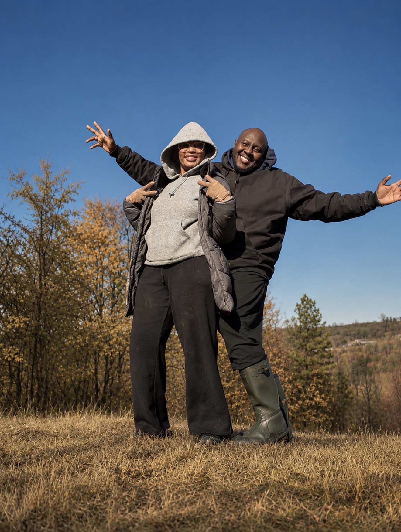 Lenkai Farms founders Andrew and Veronica Muchiri standing together on their Virginia farm